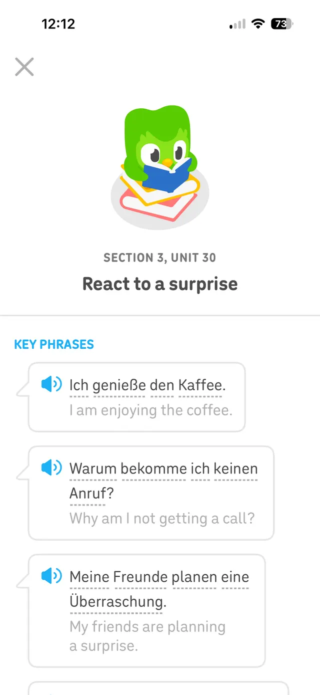 Mobile language-learning lesson page with a close button, illustration of a green owl reading, section title 'Section 3, Unit 30', lesson title 'React to a surprise', and key phrases shown in speech-bubble cards with audio icons and bilingual sentences.
