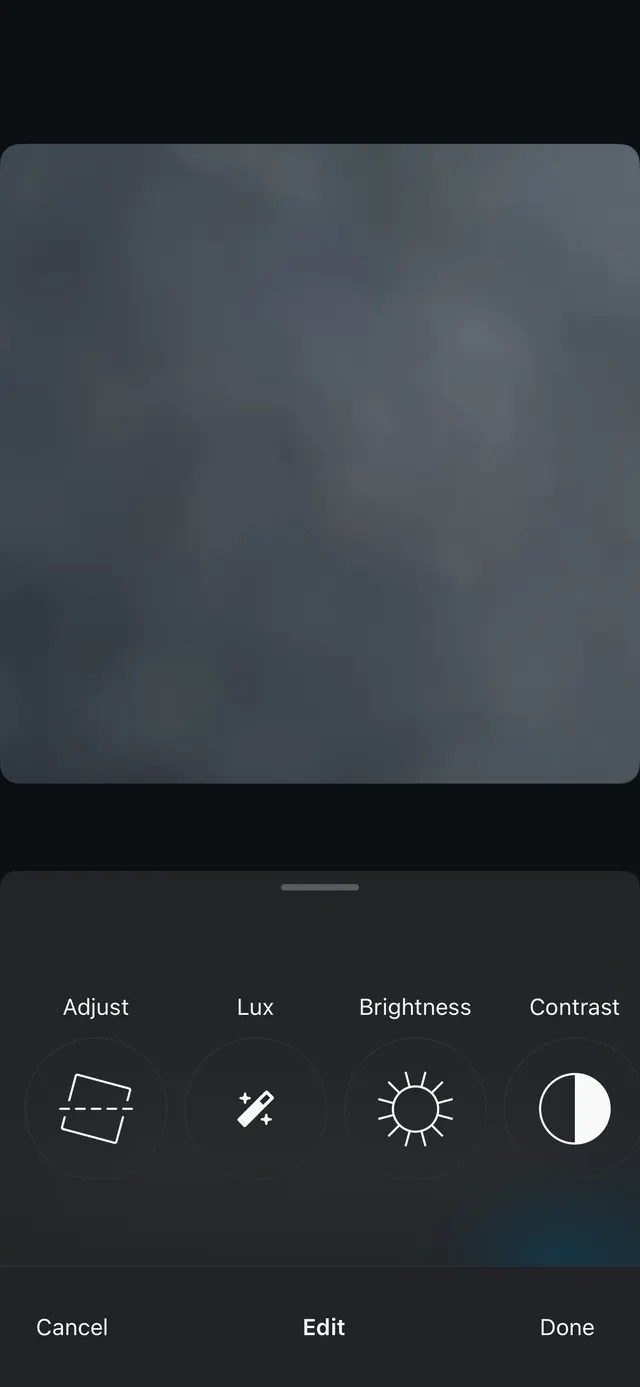 Dark photo editing interface with a large image preview on top and a bottom sheet showing circular tool buttons for Adjust, Lux, Brightness, and Contrast, plus Cancel, Edit, and Done actions.