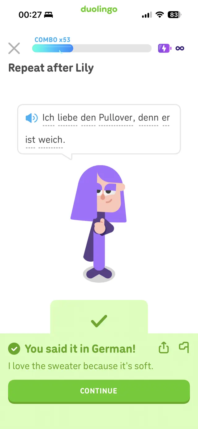 Duolingo lesson screen showing a German translation exercise with a character illustration and a green success panel saying the user said it in German.