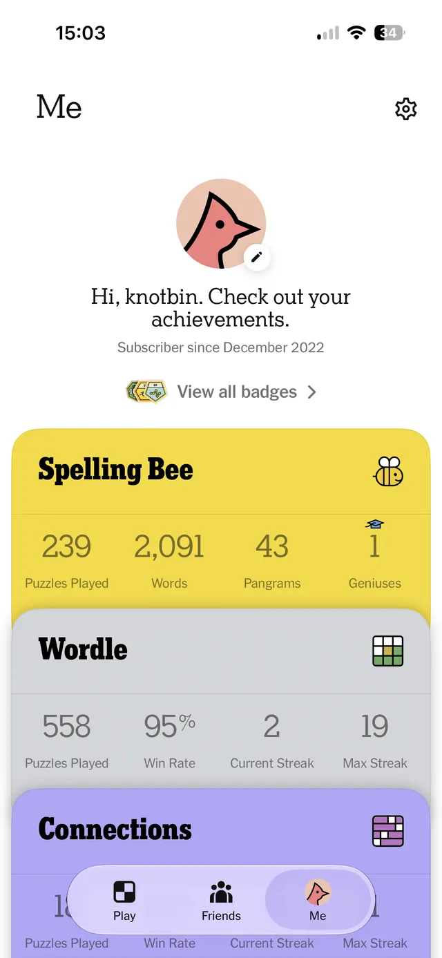 Mobile app profile screen showing user achievements and game stats for multiple puzzles, with a bottom navigation bar and settings icon.
