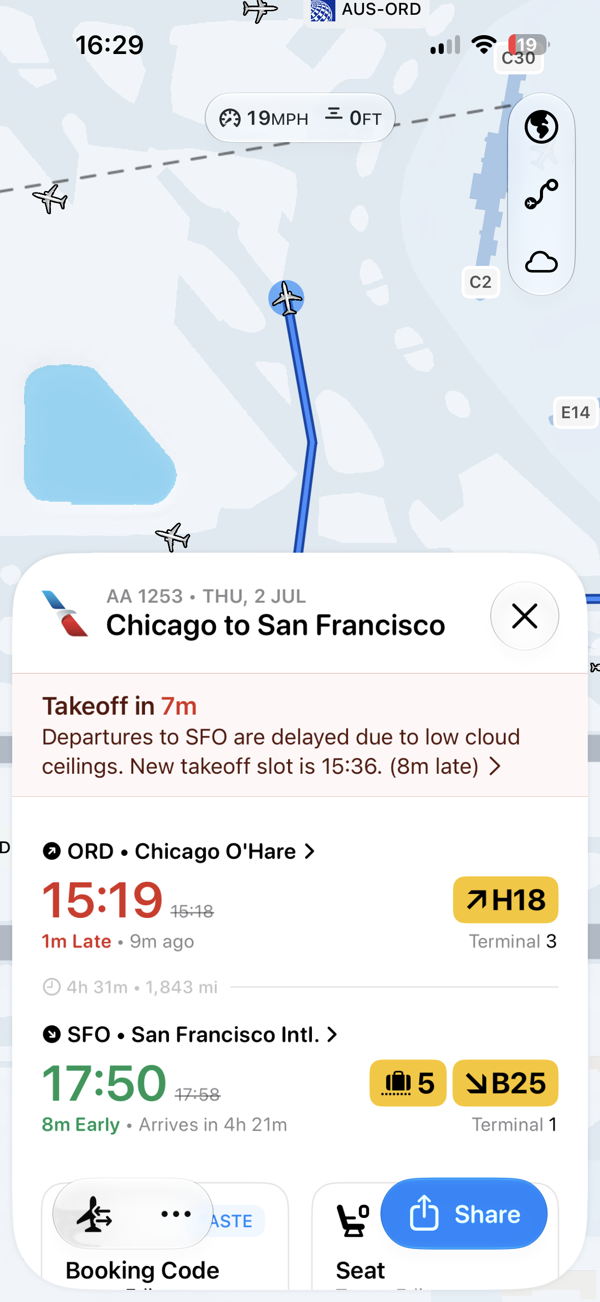 A flight tracking app showing a map with airplane icons and a bottom sheet containing flight status, departure and arrival times, terminals, and action buttons like share.