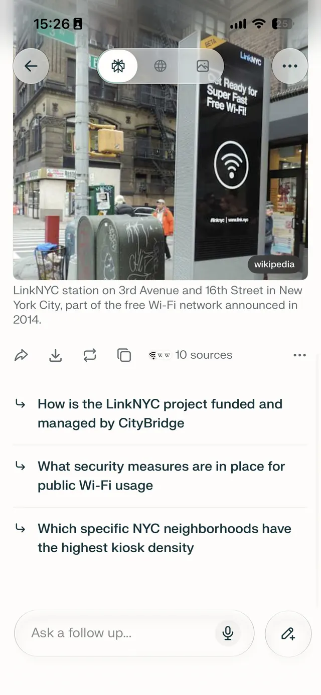 Mobile AI search result page showing a Wikipedia image and caption about a LinkNYC station, with related follow-up questions and an ask follow-up input at the bottom.