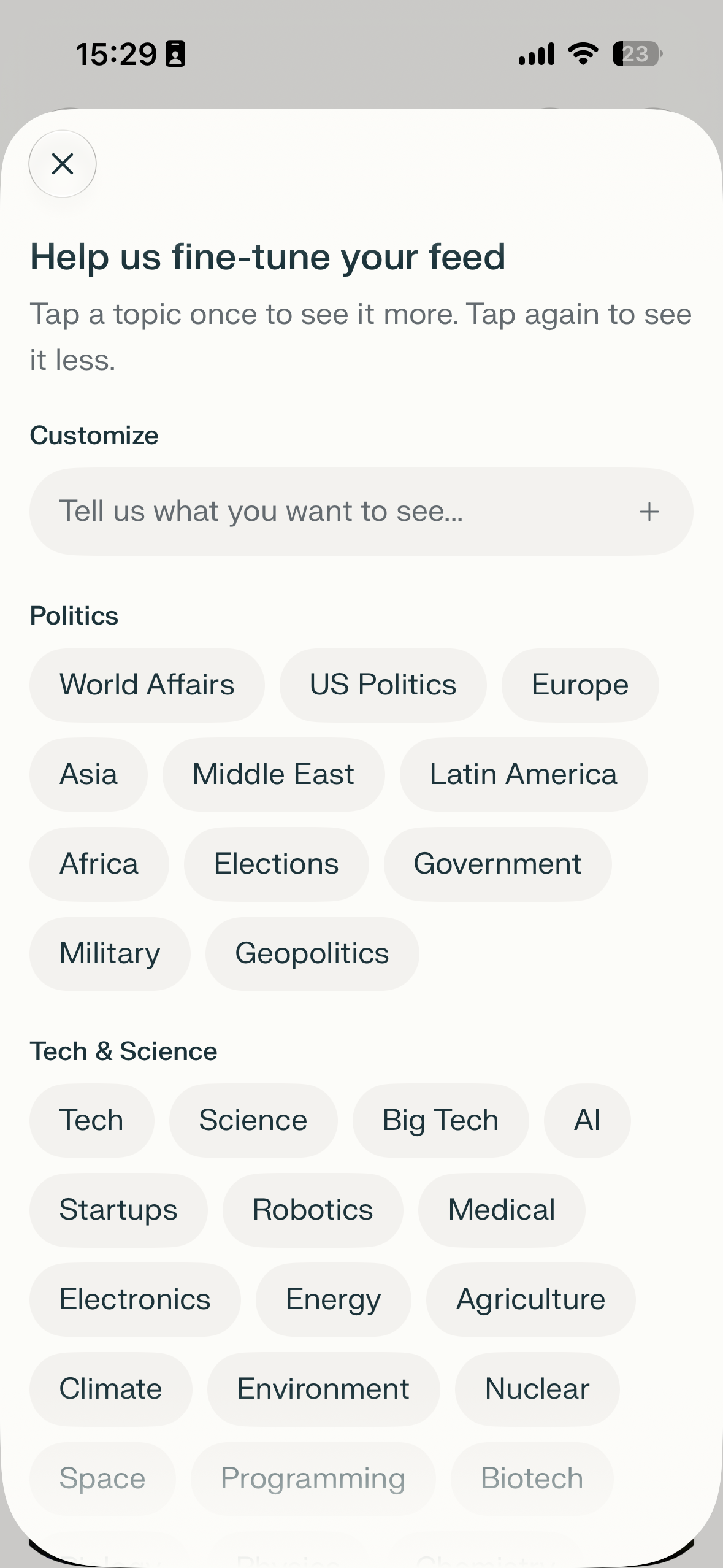 A mobile bottom sheet modal for customizing feed topics, with a close button, a search-style add field, and selectable topic chips under Politics and Tech & Science.